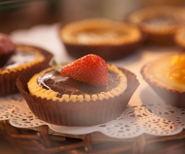 A chocolate cup topped with a rasperry